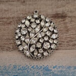 Elegant Silver tone Crystal filled Pendant